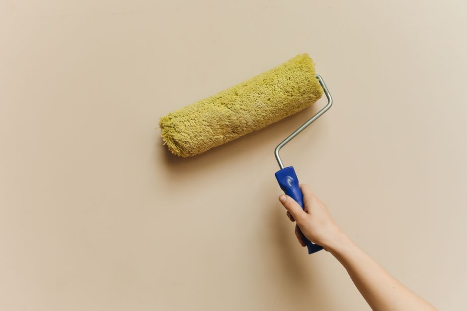 Painting a wall with a roller